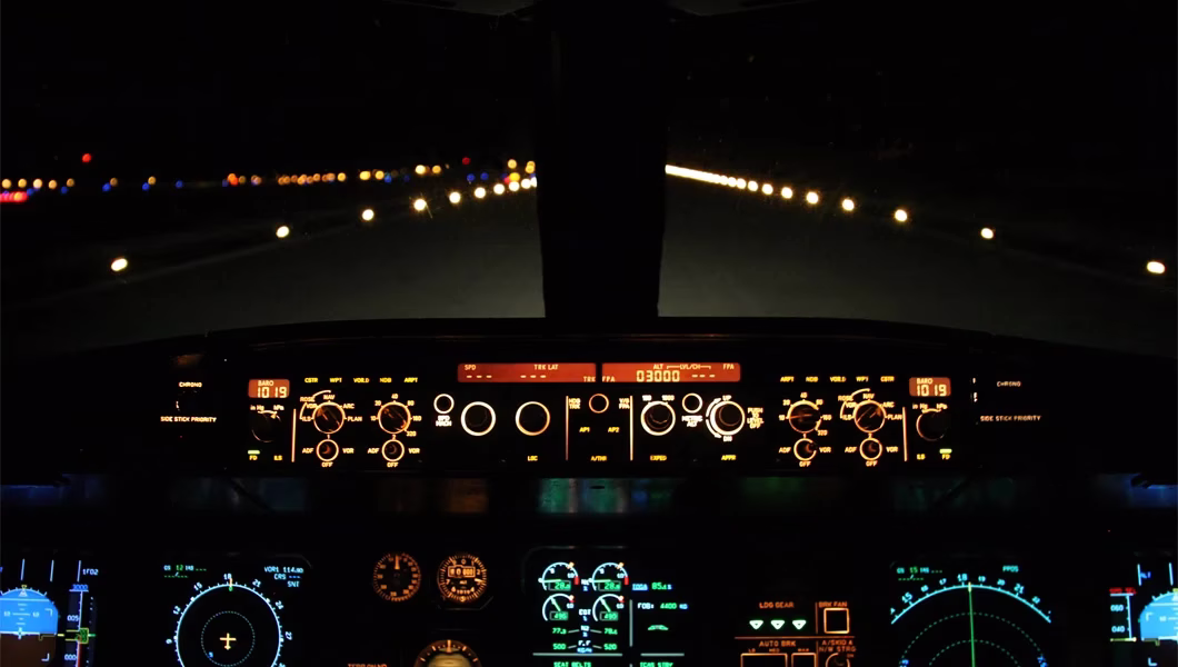 taxiway ground lights at night from a cockpit